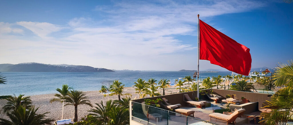 hotel with ocean view, red flag